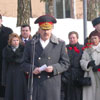 Belarusian Interior Minister Vladimir Naumov is reading the official address. [Press for large view]